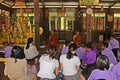 They sit and pray to Buddha in the BUDDHIST LENT DAY.